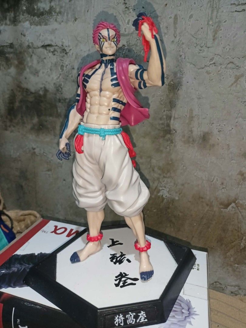Demon Slayer Akaza Figure (Category: Figurines & Statues) located in Caloocan City. Submitted by melm36307-44280 (Listing ID 1462576464, Image 2). Description: - Demon Slayer Akaza Figure - Includes display base with Japanese characters - Highly detailed sculpt and paintwork - No issue No dents.