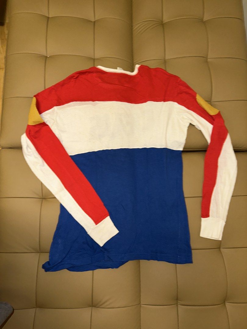 Deus Ex Machina Long Sleeve Mesh Shirt (Category: Tshirts & Polo Shirts ) located in Quezon City. Submitted by mancave_stuff (Listing ID 1462517864, Image 2). Description: - Deus Ex Machina long sleeve shirt - Made with breathable mesh material - Striking red, white, and blue color block design - Features the iconic Deus logo on the front - Smaller Deus logo detail on the sleeve hem - Unique yellow accents on shoulders and elbows - Ideal for casu