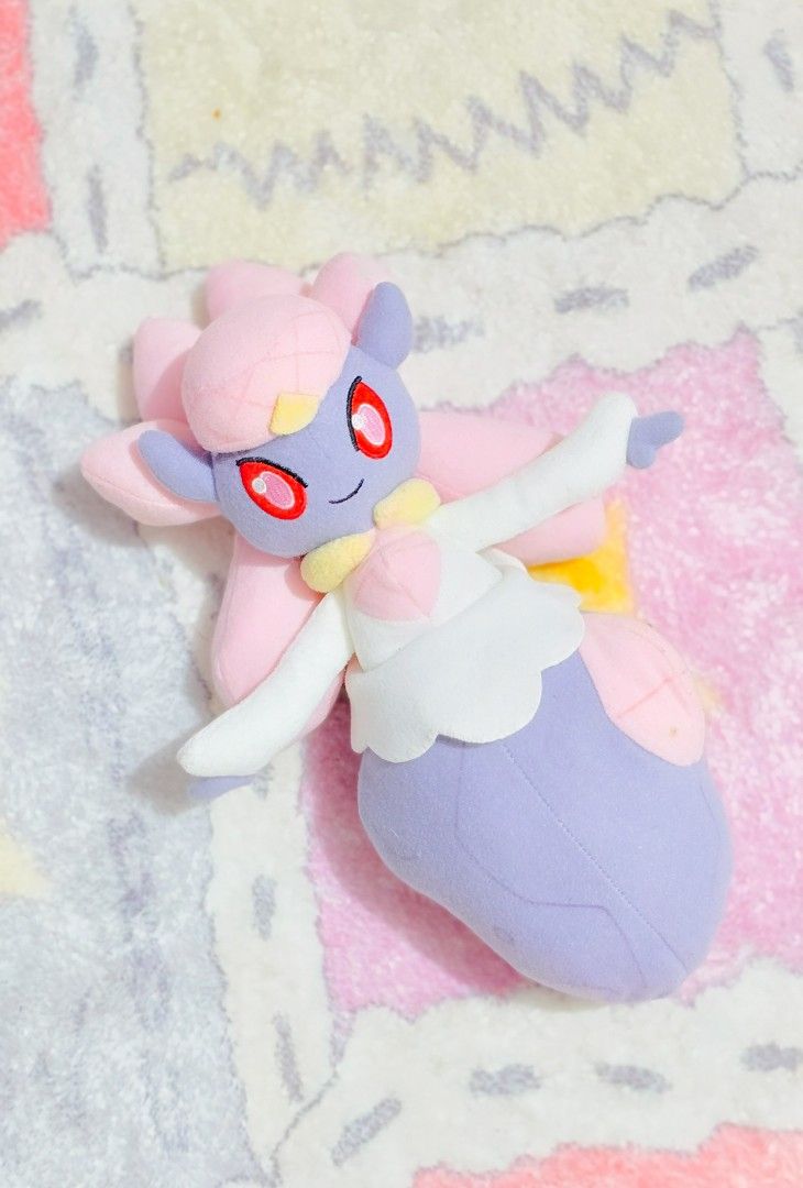 Diancie Pokemon Plush (Category: Plushies & Soft Toys) located in Paranaque City. Submitted by vanchris84 (Listing ID 1462647264, Image 1). Description: - Adorable Pokemon Diancie plush toy - Banpresto etiketa - Approximately 8 inches tall - Super soft and cuddly material - Ideal gift for any Pokemon enthusiast - Features charming purple, pink, and yellow colors - Looking for a loving new home!.