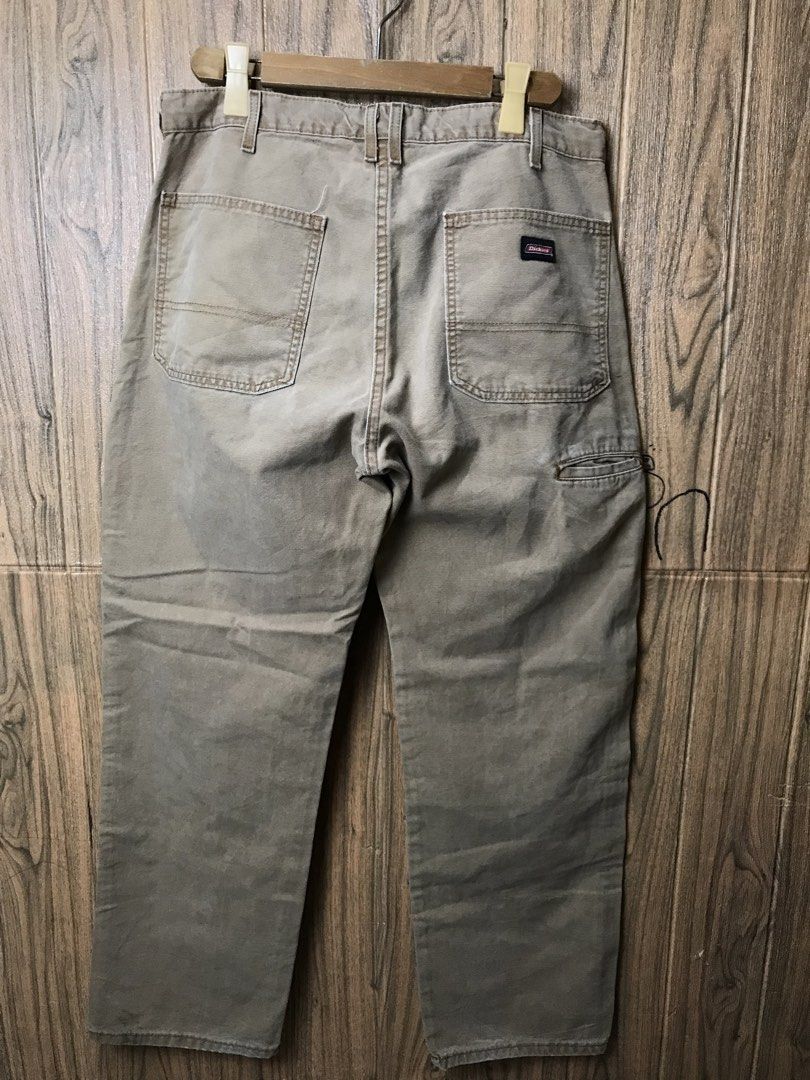 Dickies Relaxed Fit Khaki Work Pants 36x32 (Category: Jeans) located in Aloguinsan. Submitted by jayhooukay (Listing ID 1462584478, Image 1). Description: - Brand: Dickies - Color: Khaki - Size: 36x32 - Fit: Relaxed - Material: Cotton-Polyester Blend - Origin: Made in Mexico - Closure: Button Fly - Pockets: Two back pockets, one small utility pocket on right leg - Condition: Sturdy, great for work or casual wear. Minor marks on the front leg..