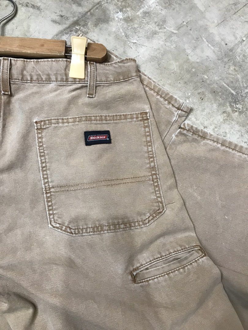 Dickies Relaxed Fit Khaki Work Pants 36x32 (Category: Jeans) located in Aloguinsan. Submitted by jayhooukay (Listing ID 1462584478, Image 3). Description: - Brand: Dickies - Color: Khaki - Size: 36x32 - Fit: Relaxed - Material: Cotton-Polyester Blend - Origin: Made in Mexico - Closure: Button Fly - Pockets: Two back pockets, one small utility pocket on right leg - Condition: Sturdy, great for work or casual wear. Minor marks on the front leg..