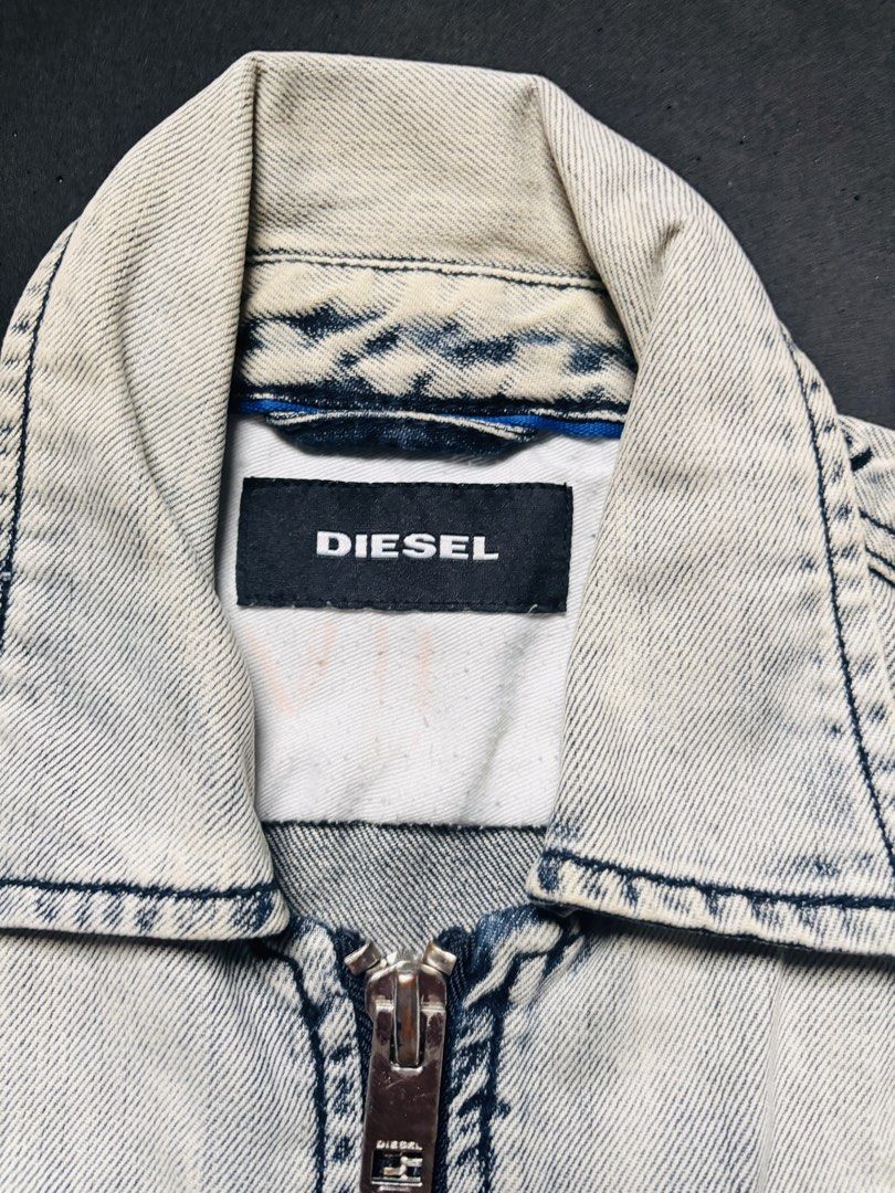 Diesel Denim Jacket - Washed Blue (Category: Coats, Jackets and Outerwear) located in Manila. Submitted by erxm.thrift (Listing ID 1462571335, Image 2). Description: - Cool Diesel denim jacket - Washed blue color - Zip-up front closure - Two chest pockets with button closures - Ideal for casual wear.