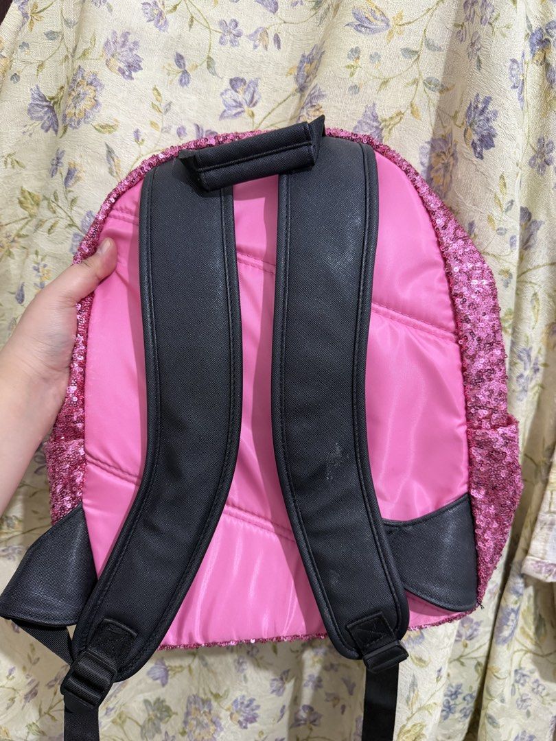 Disney Minnie Mouse Sequin Backpack Pink (Category: Backpacks) located in Binan City. Submitted by prelovedlagunaph (Listing ID 1462620366, Image 2). Description: - Adorable pink sequin backpack featuring Minnie Mouse ears and bow. - Ideal for kids or any Disney enthusiast. - Ample interior space for essentials. - Adjustable straps for a comfortable fit. - Secure zip closure. - Fun and eye-catching sparkly design..