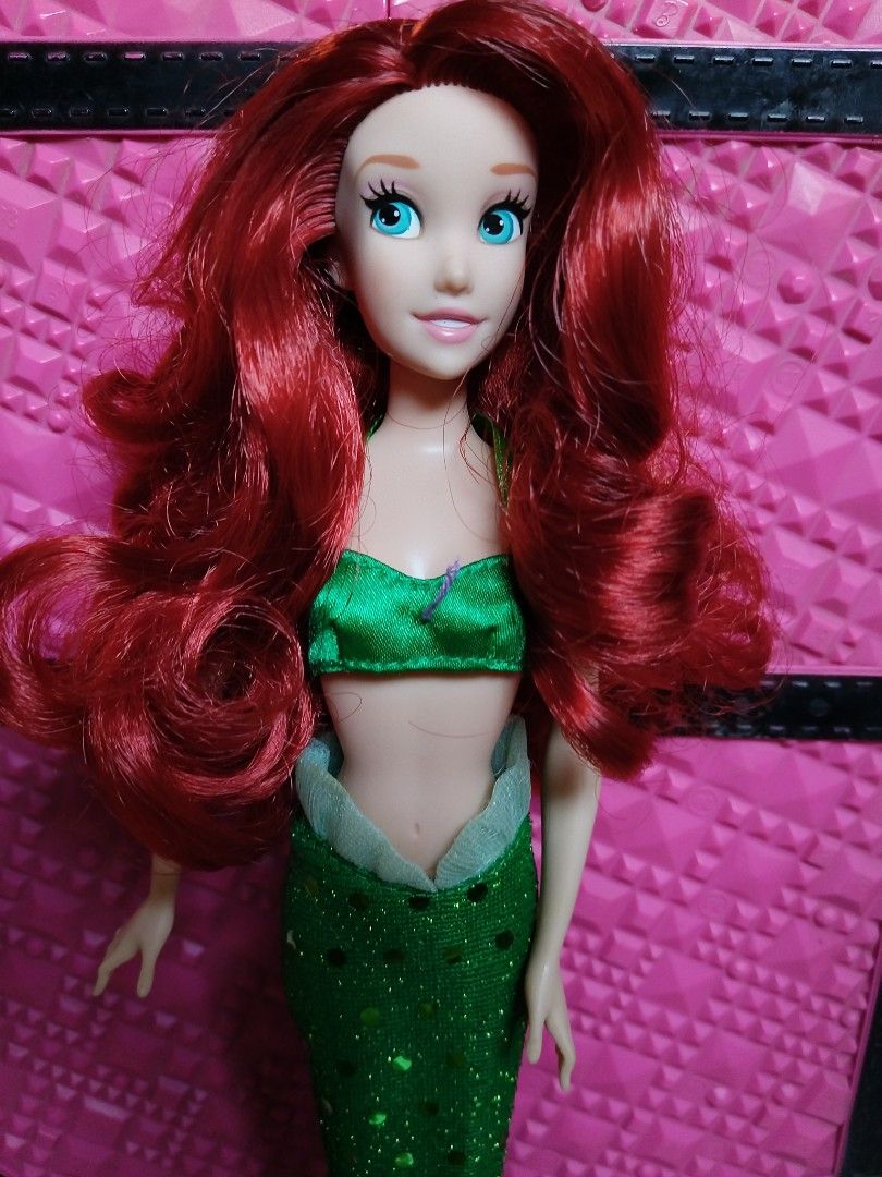 Disney Parks Ariel (Category: Figurines & Statues) located in Goa. Submitted by liz1104 (Listing ID 1462506234, Image 2). Description: Authentic Disney Parks produced doll. Rubber legged no bitemarks no cracked neck no penmarks no broken limbs nor glued parts missing purple seashell design on top. Gcash First to pay.