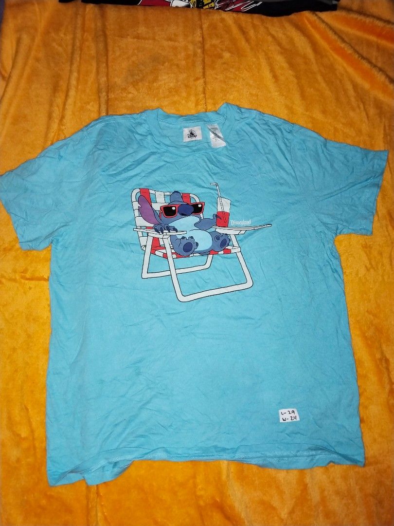 Disneyland Stitch Tee XL (Category: Tshirts & Polo Shirts ) located in Mabalacat. Submitted by al_amin_thrift (Listing ID 1462443819, Image 1). Description: Disneyland Stitch "Chill Mode" Tee — Size XL L 30 W 24 ​ - ✅ Authentic Disney Parks merchandise ​ - Super cute Stitch graphic — relaxing beach style ​ - Bright sky blue — fun & vibrant ​ - 100% soft cotton — comfortable all day ​ - Size: XL ​ - Pre‑owned: clean, no damage Genuine Disney — Sti