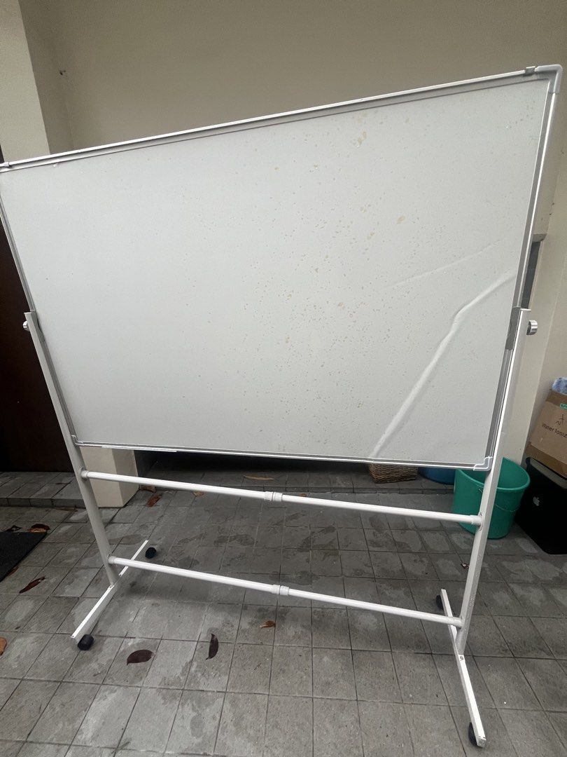 Double-Sided Whiteboard on Wheels (Category: Office Furniture & Fixtures) located in Tanauan. Submitted by lscape.handicraft (Listing ID 1462530677, Image 2). Description: - Double-sided whiteboard - Sturdy stand with wheels for easy mobility - Ideal for offices, classrooms, and home use Issues: There are some folds, but barely noticeable, it arrived like that when I ordered it from the orange app If you see the yellow marks, it’s just the plasti