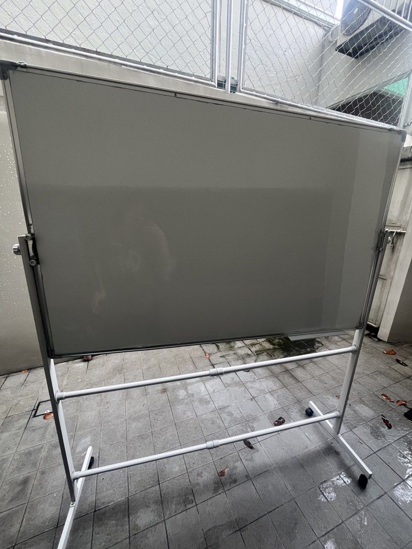 Double-Sided Whiteboard on Wheels (Category: Office Furniture & Fixtures) located in Tanauan. Submitted by lscape.handicraft (Listing ID 1462530677, Image 1). Description: - Double-sided whiteboard - Sturdy stand with wheels for easy mobility - Ideal for offices, classrooms, and home use Issues: There are some folds, but barely noticeable, it arrived like that when I ordered it from the orange app If you see the yellow marks, it’s just the plasti