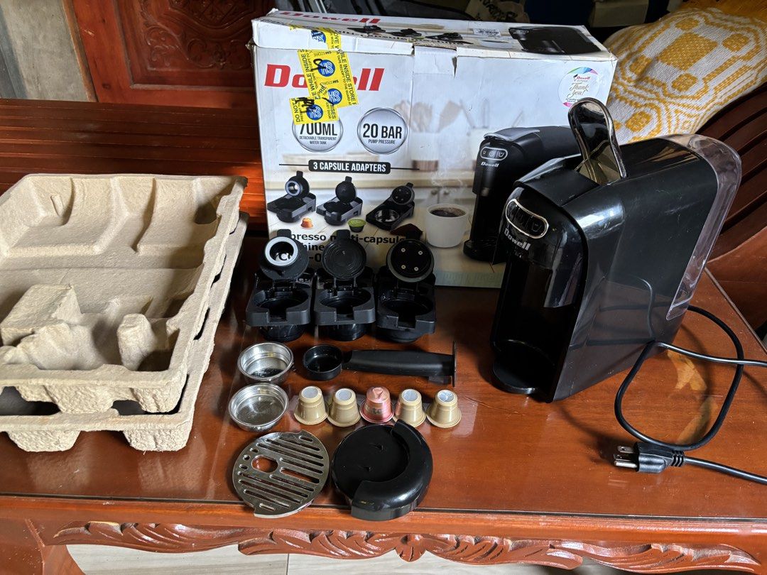 Dowell Espresso Multi-Capsule Machine (Category: Coffee Machines & Makers) located in Baguio. Submitted by pinkynj (Listing ID 1462521699, Image 1). Description: - Dowell Coffee Maker - Includes 3 capsule adapters for versatility - Powerful 20 bar pump pressure for rich espresso - 700ml detachable water tank - Comes with scoop and filter baskets - Original box and packaging included - Ready to make your perfect morning coffee - 5 free pods not su