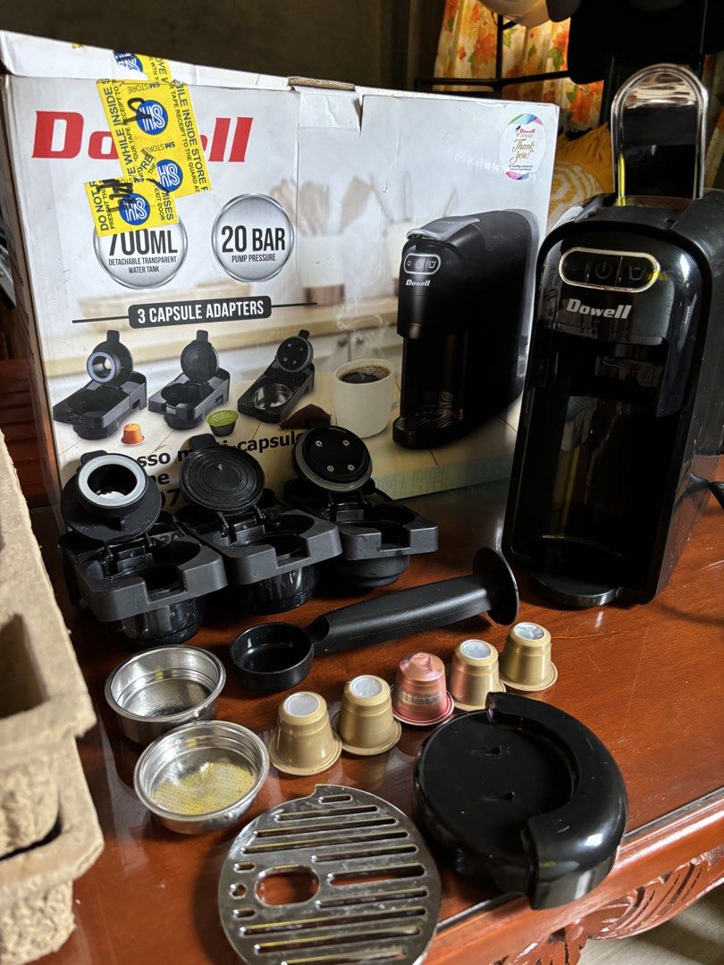 Dowell Espresso Multi-Capsule Machine (Category: Coffee Machines & Makers) located in Baguio. Submitted by pinkynj (Listing ID 1462521699, Image 2). Description: - Dowell Coffee Maker - Includes 3 capsule adapters for versatility - Powerful 20 bar pump pressure for rich espresso - 700ml detachable water tank - Comes with scoop and filter baskets - Original box and packaging included - Ready to make your perfect morning coffee - 5 free pods not su
