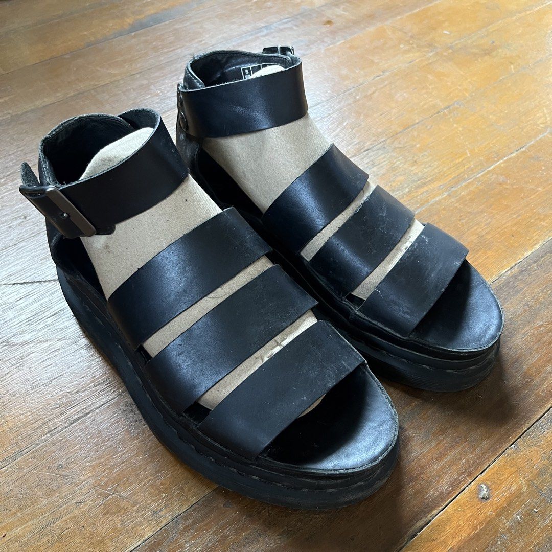 Dr. Martens Clarissa Black Leather Platform Gladiator Sandals (Category: Flats & Sandals) located in Manila. Submitted by msruiten (Listing ID 1462500816, Image 2). Description: - Dr. Martens black leather gladiator sandals - Platform sole for added height - Secure ankle buckle closure; black stitch instead of yellow - Iconic Dr. Martens air-cushioned sole - Got them here at Carousell for a higher price RFS: I don’t use them anymore .