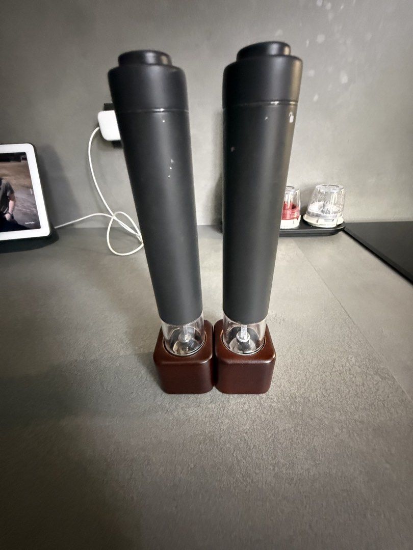 Electric Pepper Grinder Set with Charging Base (Category: Cookware & Accessories) located in Manila. Submitted by ponyo.1 (Listing ID 1462469331, Image 1). Description: - Set of 2 electric pepper grinders - Includes charging base - Sleek black grinders with clear viewing compartments - Dark brown charging base - Effortlessly season your meals - Easy to use and recharge.