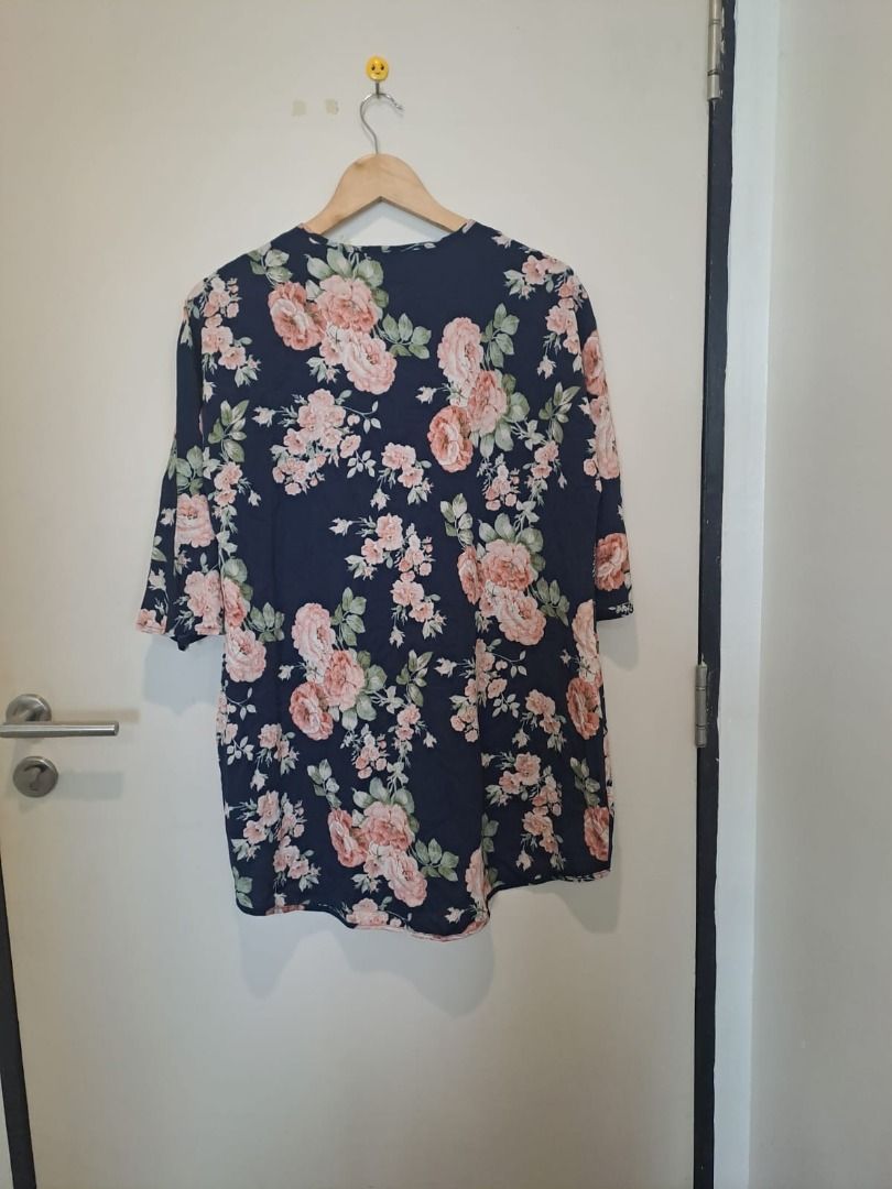 EMERE ROSE COVER UP TOPS (Category: Others Tops) located in Mandaluyong City. Submitted by epicowl-c93c (Listing ID 1462580588, Image 3). Description: The image displays a navy blue floral kimono cardigan featuring a romantic pink and cream rose print with green foliage by Emere Rose This lightweight, open-front layering piece is excellent for transitioning between seasons or building effortless casual looks.