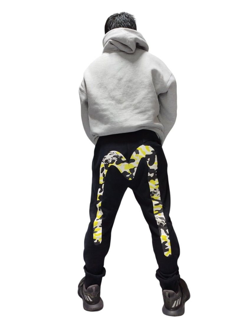 EVISU YELLOW CAMOUFLAGE DAICOCK JOGGER PANTS (Category: Joggers) located in Bayombong. Submitted by Gentlemans_ClosEt (Listing ID 1462619603, Image 3). Description: EVISU YELLOW CAMOUFLAGE DAICOCK JOGGER PANTS SIZE LARGE WAISTLINE 30-36 LENGTH 38 9.5/10 COLOR RATE GOOD CONDITION VERY MINIMAL HAIRLINE CRACK PRINT.