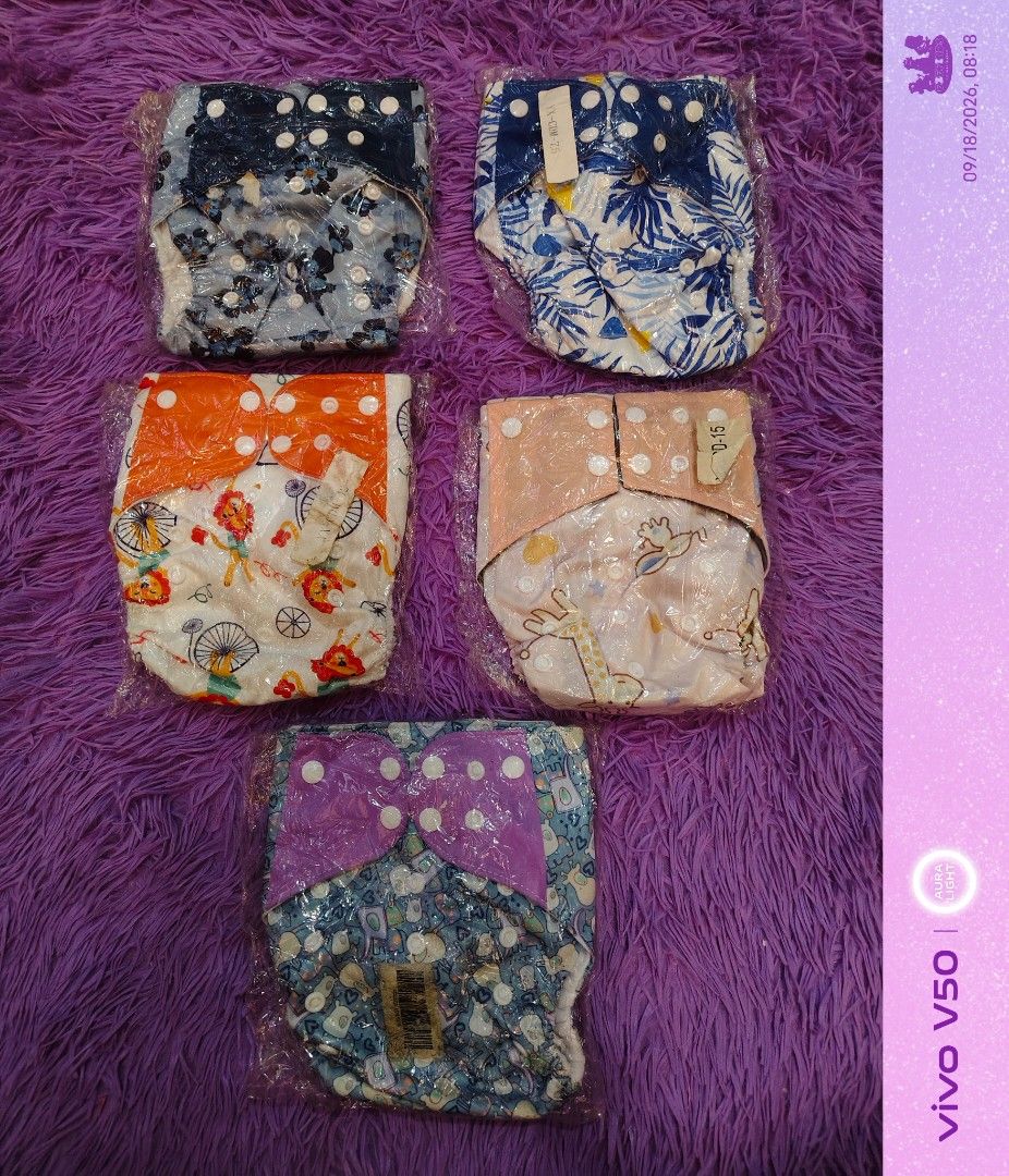 EZEFINDS Reusable Cloth Diapers with Cute Prints - Shell only (Category: Diapers & Baby Wipes) located in Cainta. Submitted by Ezefinds (Listing ID 1462442124, Image 2). Description: - Bundle of 5 reusable cloth diapers shell only Newborn to Toddlers - Features various cute and fun prints - Adjustable for a comfortable fit - Eco-conscious choice for parents - Each diaper is individually wrapped.