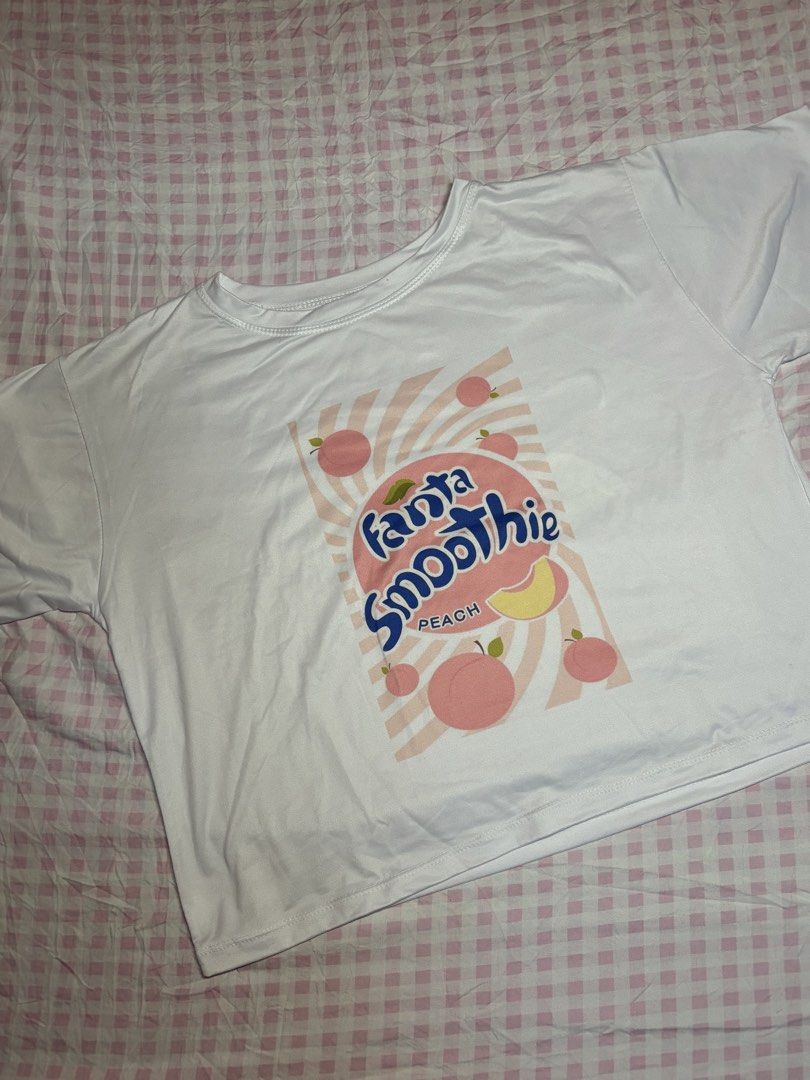 Fanta Smoothie Peach Graphic Top (Category: Shirts) located in San Juan City. Submitted by angel_aura_archive (Listing ID 1462514810, Image 1). Description: - Free size (S-L) - Please see 2nd slide as my when worn pic for your reference - All of the details are here n po so pls matuto po magbasa and no to low bailers!! I can give discount if marami po kukunin. They are not from ukay and they are from my personal collection from my closet (purpose