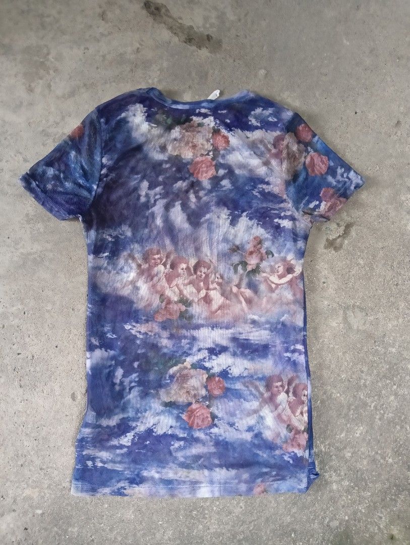 fashion blouse graphic Angels mesh type (Category: Blouses) located in Subic. Submitted by gentlecloud-8030a3 (Listing ID 1462520083, Image 2). Description: Blue mesh blouse design multiples Angels n flowers brand SweetLilac size Small Spandex excellent condition 400+shipping fee.