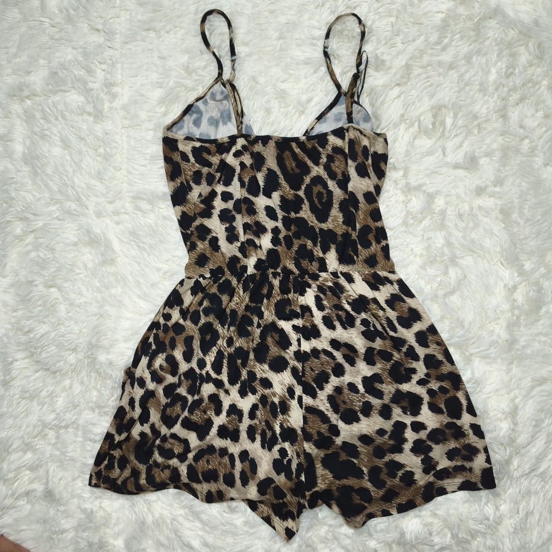 Fashion Nova Leopard Print Wrap Romper (Category: Rompers) located in Antipolo. Submitted by alphaomega_fox (Listing ID 1462573845, Image 2). Description: - Cute leopard print romper from Fashion Nova - Wrap front design with delicate spaghetti straps - Comfortable elasticated waist for a perfect fit - Versatile for a night out or casual wear - Lightweight and easy to style stretchable 13x23 200 plus sf.