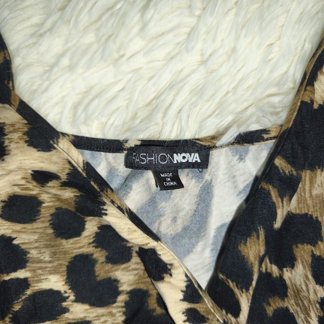 Fashion Nova Leopard Print Wrap Romper (Category: Rompers) located in Antipolo. Submitted by alphaomega_fox (Listing ID 1462573845, Image 3). Description: - Cute leopard print romper from Fashion Nova - Wrap front design with delicate spaghetti straps - Comfortable elasticated waist for a perfect fit - Versatile for a night out or casual wear - Lightweight and easy to style stretchable 13x23 200 plus sf.