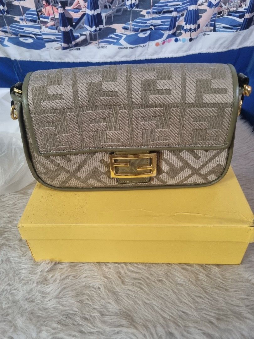 Fendi FF Monogram Canvas Bag with Box (Category: Luxury Bags & Wallets) located in Manila. Submitted by monya111 (Listing ID 1462479109, Image 1). Description: - Authentic Fendi bag - Classic FF monogram pattern - Comes with original Fendi yellow box - Gold-toned hardware - Ideal for carrying essentials.