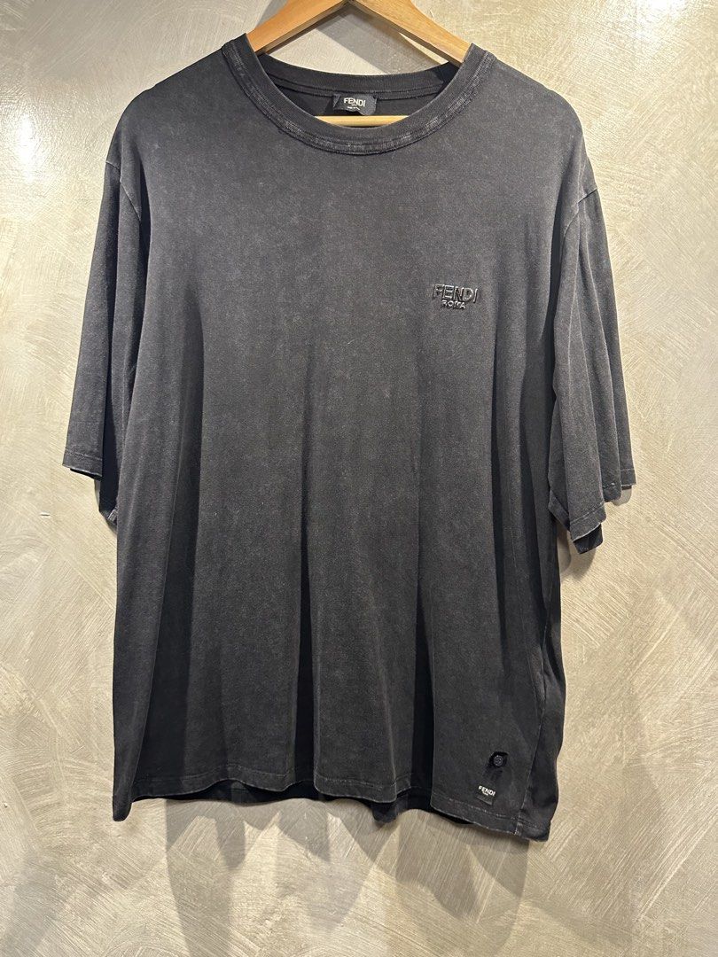 Fendi Roma T-Shirt (Category: Tshirts & Polo Shirts ) located in Manila. Submitted by gelo1999 (Listing ID 1462620004, Image 1). Description: - Authentic Fendi Roma T-shirt - Color: Charcoal grey with washed effect - Features embroidered Fendi Roma logo on chest - Small Fendi tag with button detail near hem - Made in Italy - Material: 100% Cotton - Size: M.