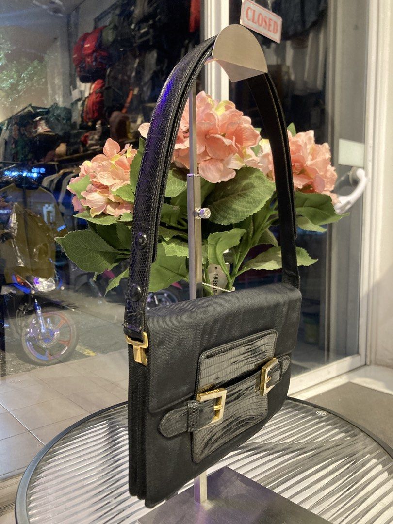 Fendi Shoulder Bag ( vintage ) (Category: Luxury Bags & Wallets) located in Quezon City. Submitted by janisu0303 (Listing ID 1462630936, Image 2). Description: - Vintage Fendi black shoulder bag - 9 x 6 dimensions - 18500 php - good condition - Fairview area meetups Or shipping - Textured material with lizard-embossed details - Gold buckle hardware on front flap - Versatile for everyday or evening wear - Clean interior - Stylish and classic desig