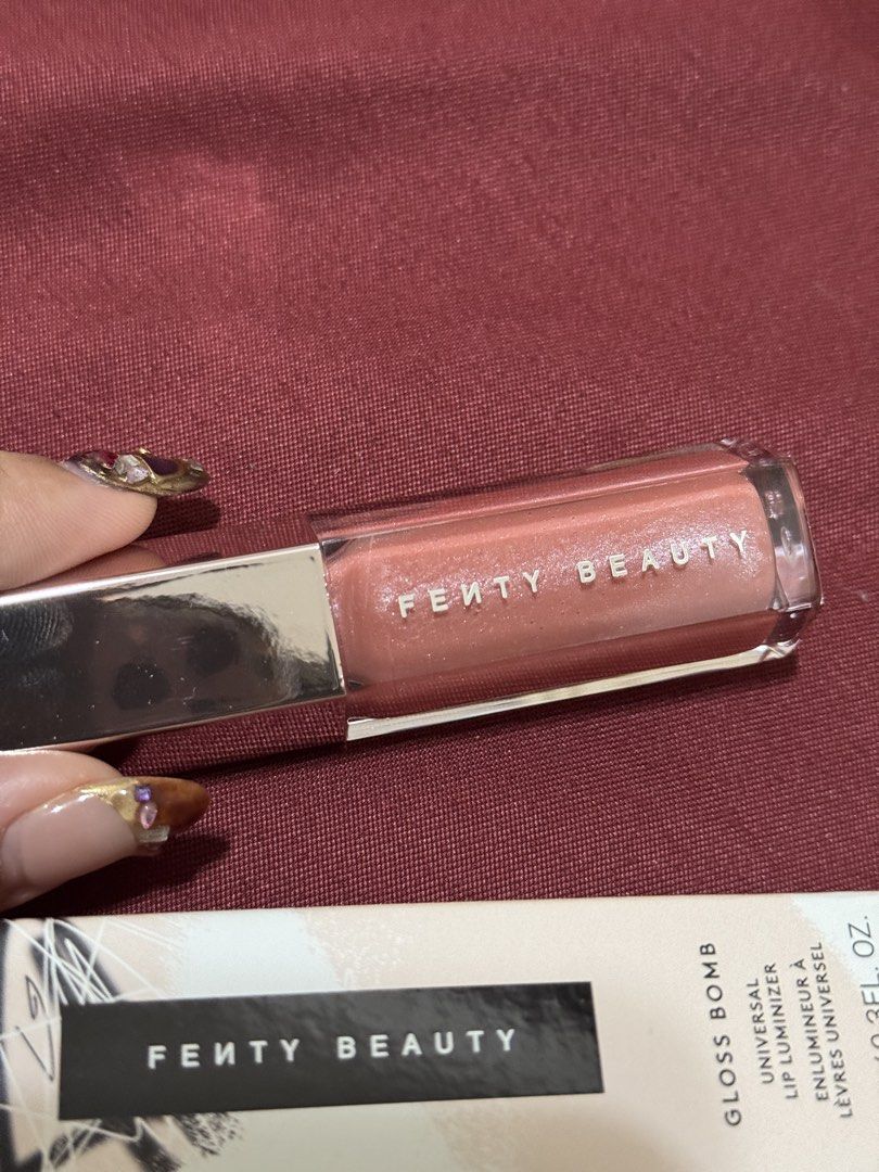 Fenty Beauty - Gloss Bomb Universal Lip Luminizer (Category: Makeup) located in Taguig. Submitted by julyuhs.dcltr (Listing ID 1462612889, Image 2). Description: Shade: FU$$Y • 9ML / 0.3FL. OZ. • Brand New • RFS: Extra!! (got it from the Fenty x Nami Matcha Collab) .