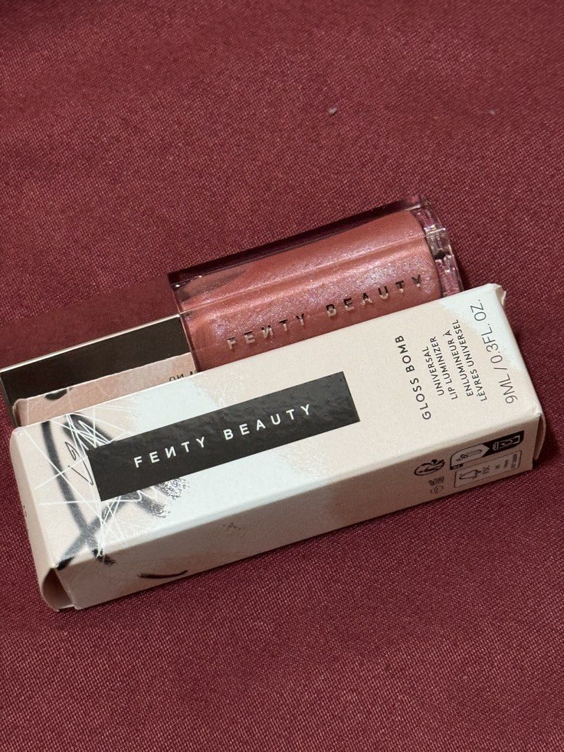 Fenty Beauty - Gloss Bomb Universal Lip Luminizer (Category: Makeup) located in Taguig. Submitted by julyuhs.dcltr (Listing ID 1462612889, Image 1). Description: Shade: FU$$Y • 9ML / 0.3FL. OZ. • Brand New • RFS: Extra!! (got it from the Fenty x Nami Matcha Collab) .