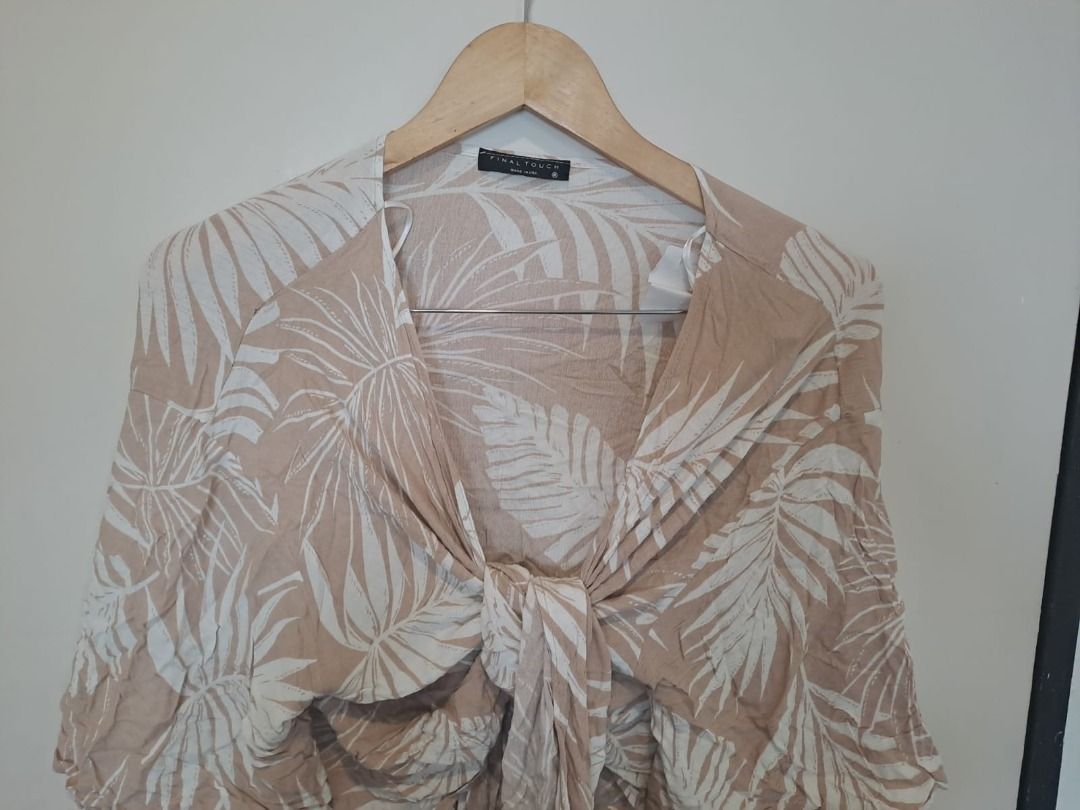 final touch tops (Category: Others Tops) located in Mandaluyong City. Submitted by epicowl-c93c (Listing ID 1462578811, Image 2). Description: This stylish piece is a beige tropical palm leaf print tie-front kimono top featuring relaxed three-quarter length sleeves and a deep V-neckline. This design is from the brand FINAL TOUCH..