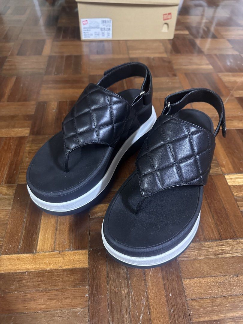 FitFlop F-Mode Stack Black Quilted Platform Thong Sandals (Category: Flats & Sandals) located in Paranaque City. Submitted by declutter_therapy (Listing ID 1462605966, Image 3). Description: - Brand: FitFlop - Worn inside the house once - Style: Black quilted platform thong sandals - Features: Adjustable ankle strap, comfortable platform sole with white stripe detail - Perfect for: Casual wear - Includes: Original box - US 8, UK 6, EU 39 - Origin
