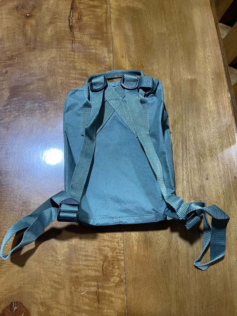 Fjallraven Kanken Mini Backpack - Green (Category: Backpacks) located in Pangantucan. Submitted by calmwhale_cb83a8 (Listing ID 1462591090, Image 3). Description: - Classic Fjallraven Kanken Mini backpack - Muted green color - Water-resistant Vinylon F fabric - Main compartment with two-way zipper - Two flat side pockets - Top handles - Adjustable shoulder straps - Ideal for everyday use or travel.