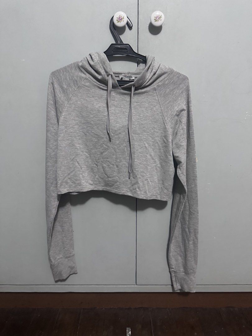Forever 21 cropped gray hoodie (Category: Coats, Jackets and Outerwear) located in Quezon City. Submitted by loontea (Listing ID 1462567437, Image 1). Description: Rfs: declutter Size: S W: 18 L: 15 📍QC, commonwealth MOP: GCASH MOD: Lalamove, grab (you will do the booking, sf paid by buyers).