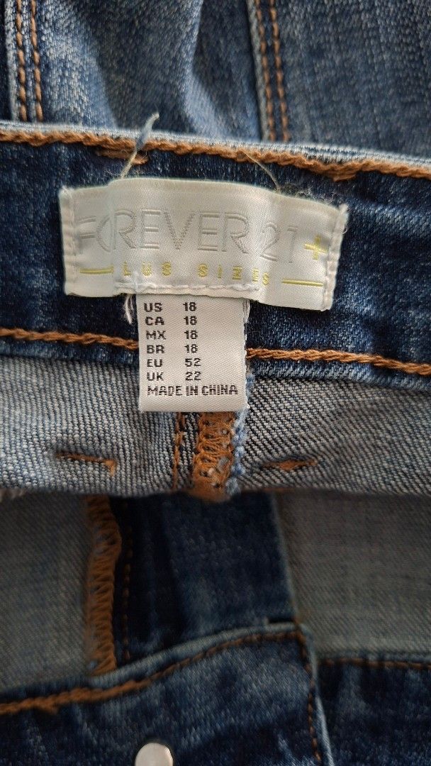 Forever 21 Plus Size Distressed Denim Shorts (Category: Shorts) located in Quezon City. Submitted by glen1014 (Listing ID 1462456339, Image 3). Description: - Forever 21 Plus Blue Denim Shorts - Features distressed details - Frayed hem for a trendy look - Comfortable fit for everyday wear - Measurements: Waist approx. 16 inches, Length approx. 10 inches.