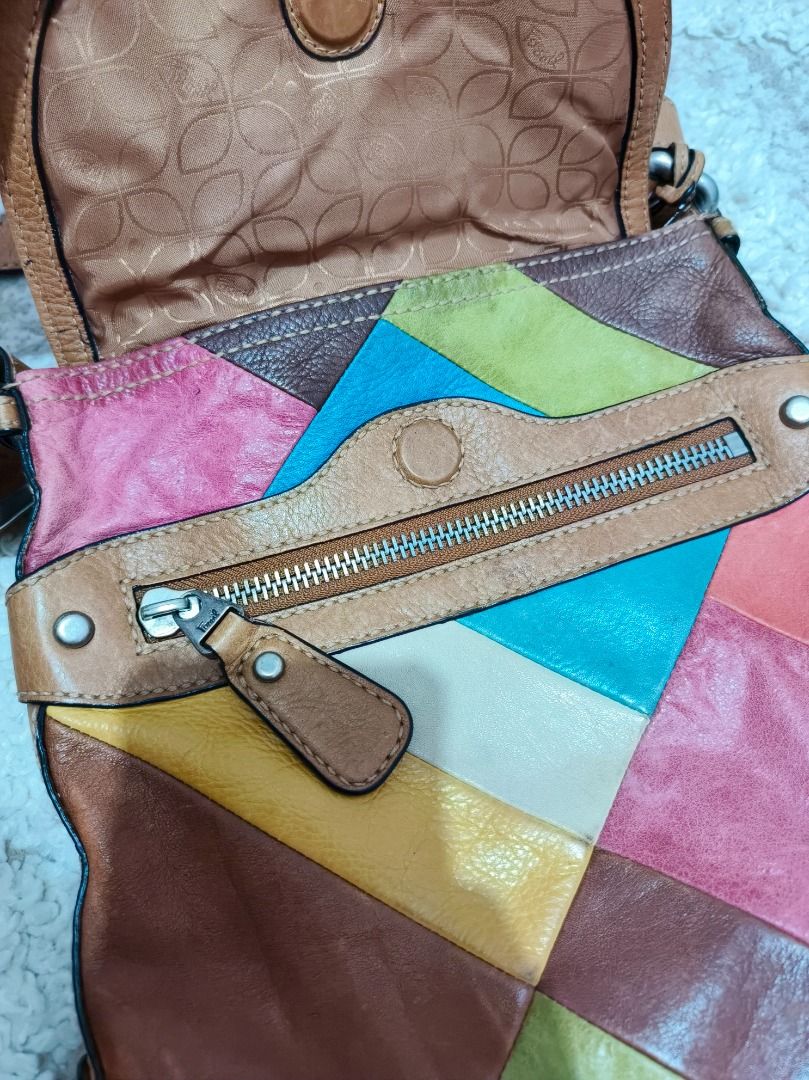 Fossil Patchwork Leather Crossbody Bag (Category: Cross-body Bags) located in Caloocan City. Submitted by adidaszler (Listing ID 1462590153, Image 3). Description: - Genuine leather crossbody bag by Fossil - Unique and colorful patchwork design - Spacious main compartment - Front pocket with zipper closure - Adjustable strap for comfortable wear - Lined interior with Fossil logo - Ideal for everyday use.