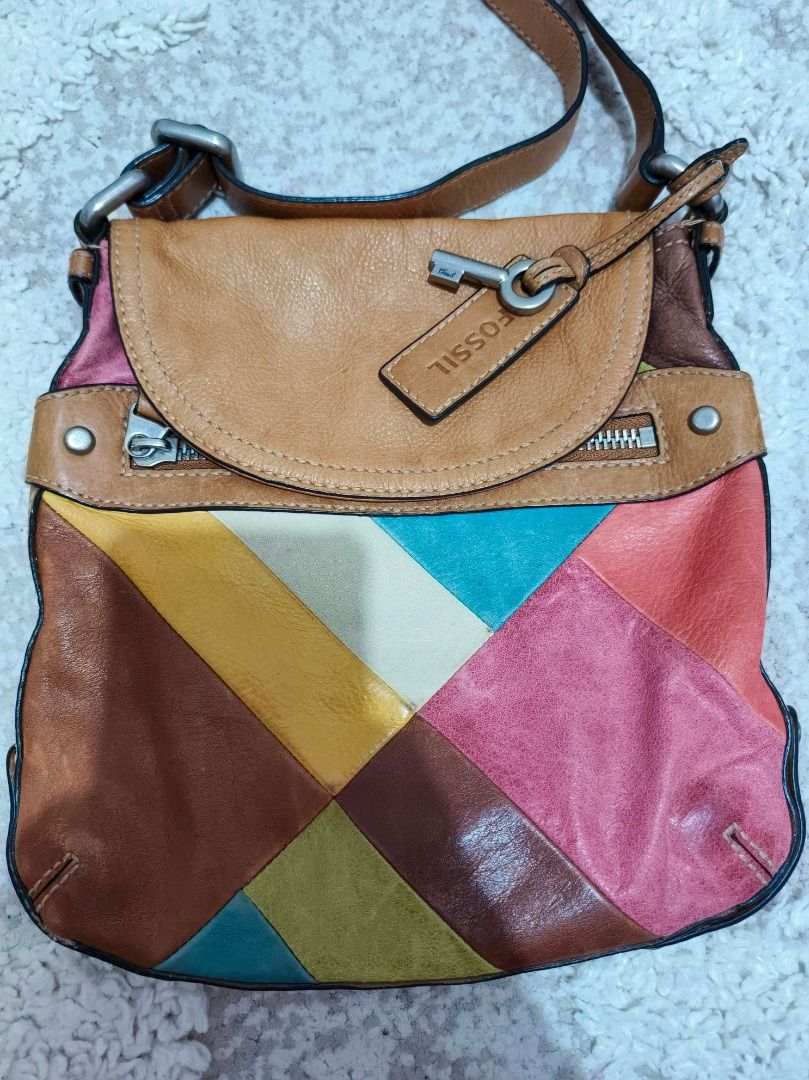 Fossil Patchwork Leather Crossbody Bag (Category: Cross-body Bags) located in Caloocan City. Submitted by adidaszler (Listing ID 1462590153, Image 1). Description: - Genuine leather crossbody bag by Fossil - Unique and colorful patchwork design - Spacious main compartment - Front pocket with zipper closure - Adjustable strap for comfortable wear - Lined interior with Fossil logo - Ideal for everyday use.