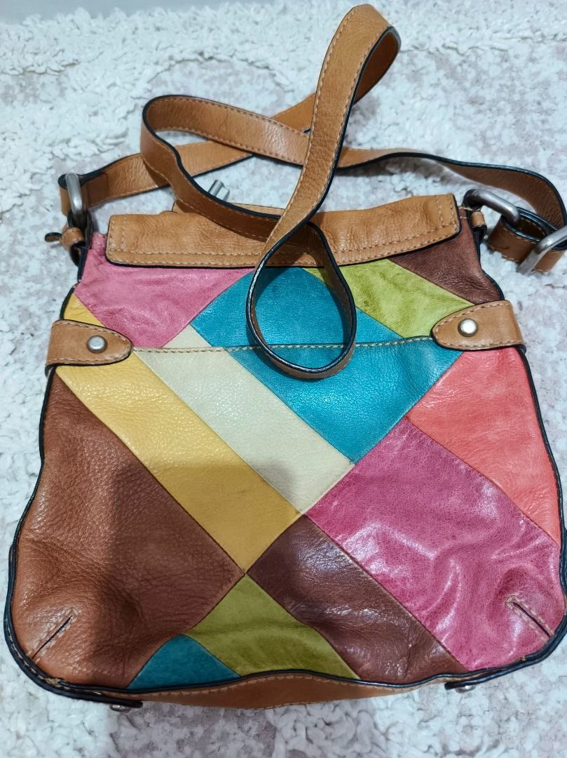 Fossil Patchwork Leather Crossbody Bag (Category: Cross-body Bags) located in Caloocan City. Submitted by adidaszler (Listing ID 1462590153, Image 2). Description: - Genuine leather crossbody bag by Fossil - Unique and colorful patchwork design - Spacious main compartment - Front pocket with zipper closure - Adjustable strap for comfortable wear - Lined interior with Fossil logo - Ideal for everyday use.