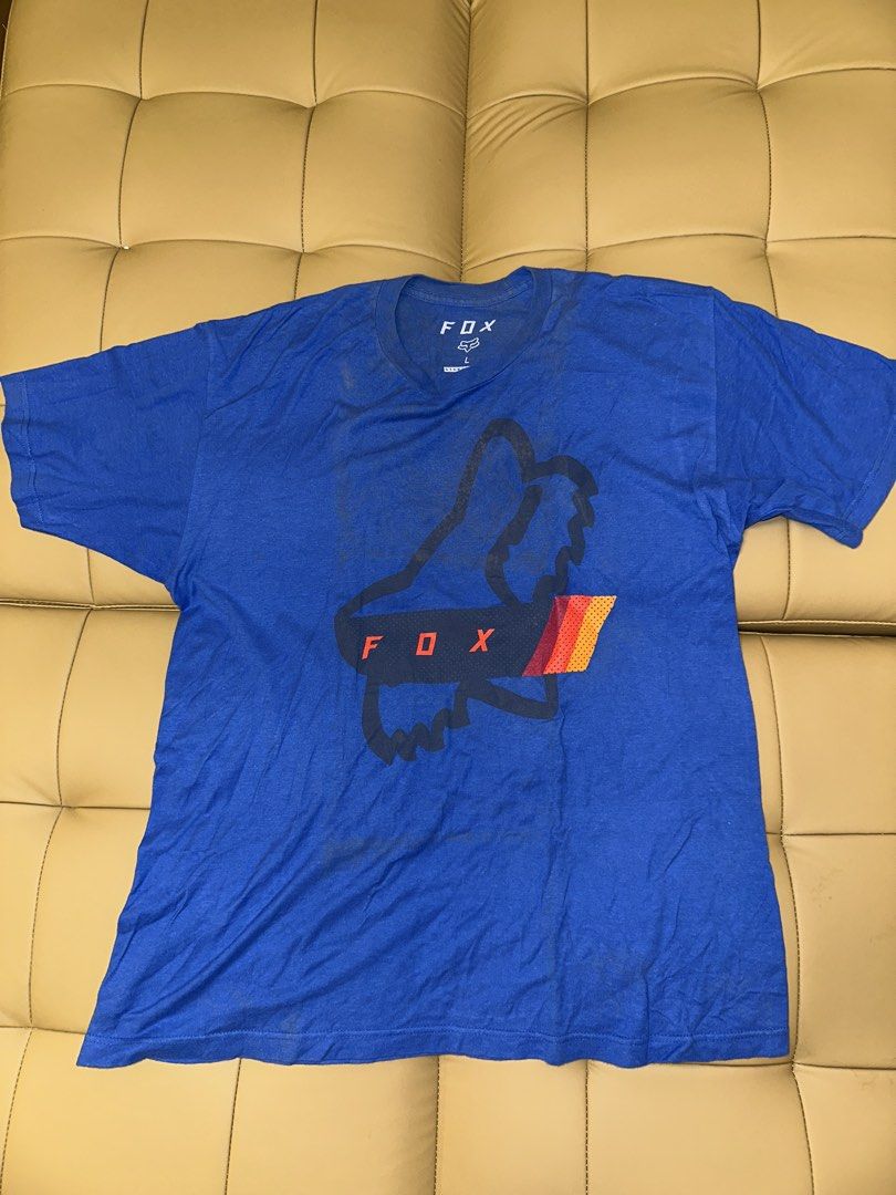 Fox Racing Blue T-Shirt Size L (Category: Tshirts & Polo Shirts ) located in Quezon City. Submitted by mancave_stuff (Listing ID 1462520473, Image 1). Description: - Blue Fox Racing T-shirt - Standard Fit, Size L (21 x 27) - 100% Cotton - Iconic Fox head logo on front - Perfect for casual wear or riding - Minor marks on fabric (please check photos).
