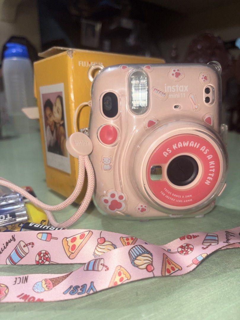 Fujifilm Instax Mini 11 Pink Camera with Accessories (Category: Cameras) located in Las Pinas. Submitted by raretree_4cff17 (Listing ID 1462658878, Image 2). Description: Pink Fujifilm Instax Mini 11 camera with strap, case, and batteries..
