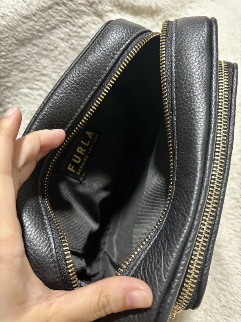 Furla Black Rea Crossbody Bag (Category: Luxury Bags & Wallets) located in Quezon City. Submitted by _aritan (Listing ID 1462518403, Image 3). Description: - Authentic Furla black leather crossbody bag - Adjustable strap for comfortable wear RFS: not being used Loc: quezon city MOD: Lalamove / Gogo Express / Meet up @ Fishermall QC - SF shoulder by buyer MOP: GCash.