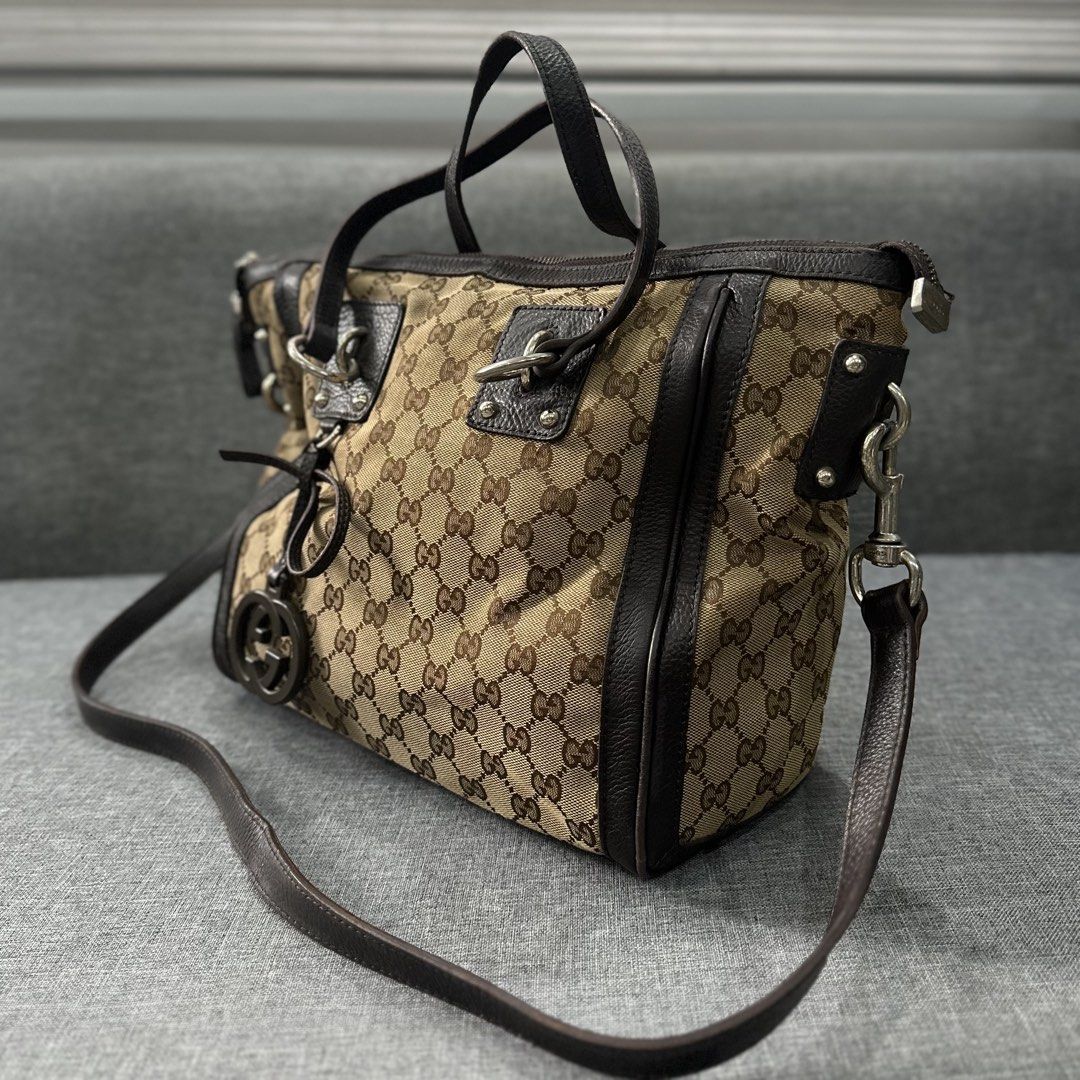 GG Canvas Medium Charm Satchel Bag (Category: Cross-body Bags) located in Tanza. Submitted by edzelg5r62292 (Listing ID 1462554081, Image 1). Description: Dimensions: Length: 12 inches Width: 15 inches 9/10 condition faded hardwares no zipper puller inside what you see is what you get with provided dust bag .