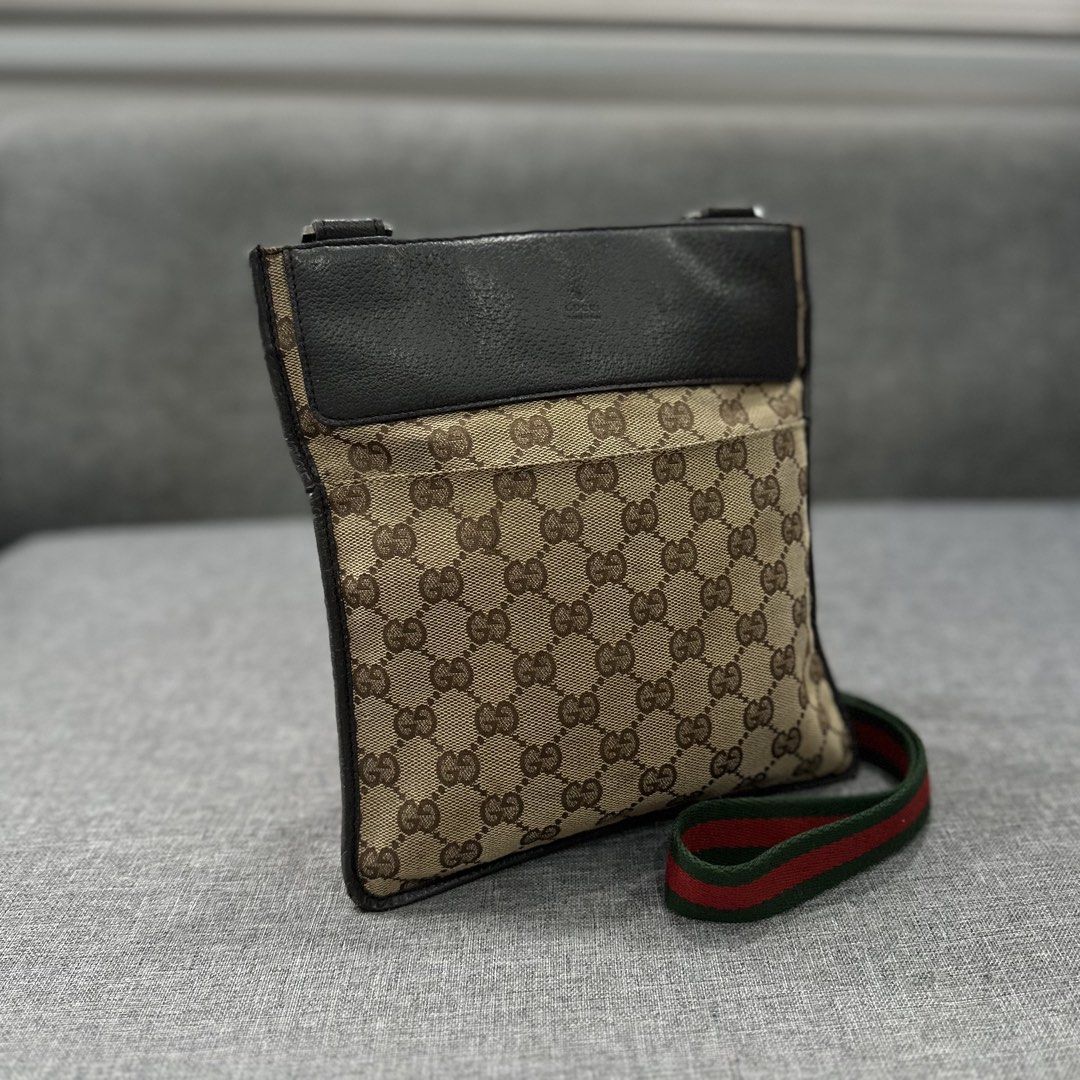 GG Crossbody Bag (Category: Cross-body Bags) located in Tanza. Submitted by edzelg5r62292 (Listing ID 1462556912, Image 1). Description: Dimensions: Length: 9 inches Width: 9.5 inches 9/10 condition repaired sling hook temporary what you see is what you get with provided dustbag .