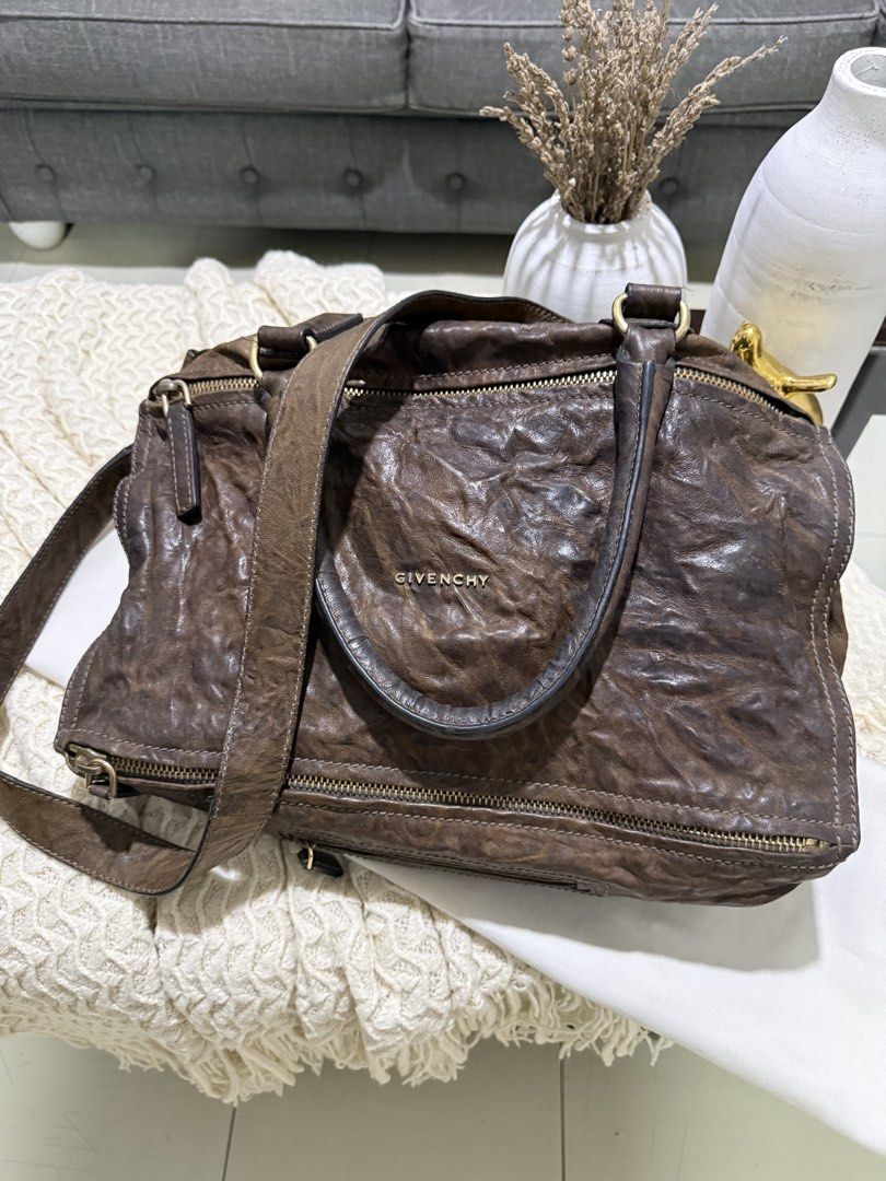 Givenchy Brown Leather Pandora Large Bag (Category: Luxury Bags & Wallets) located in Manila. Submitted by blueginger747 (Listing ID 1462611918, Image 3). Description: - Authentic Givenchy Pandora large size - Slouchy, distressed Pepe leather aesthetic for a relaxed vibe - Elegant gold hardware details - Includes original dust bag - Ideal everyday carry-all Got this preloved too, had this with me for years but this bag still has a whole lot of li