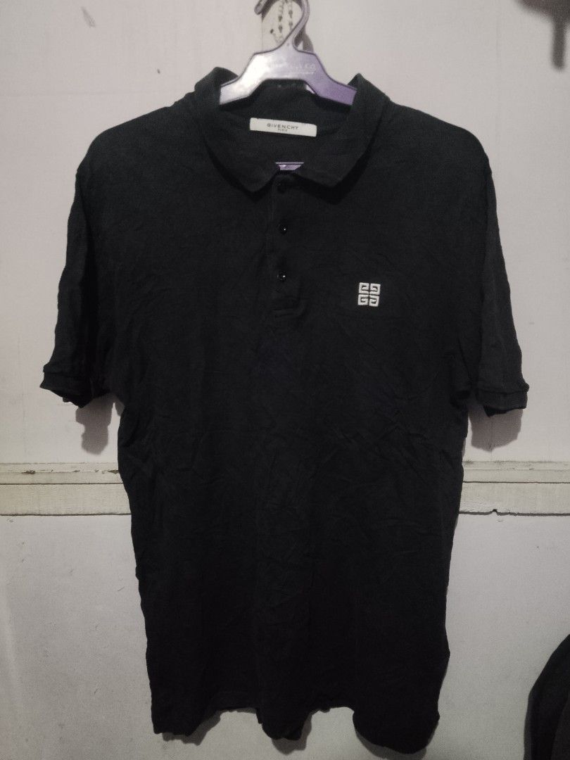 Givenchy Paris Black Polo Shirt with Logo (Category: Tshirts & Polo Shirts ) located in Quezon City. Submitted by theoneshop1 (Listing ID 1462472423, Image 1). Description: - Authentic Givenchy Paris black polo shirt - Features signature Givenchy logo on the chest - Classic collar and button placket - Short sleeves - Ideal for casual wear.