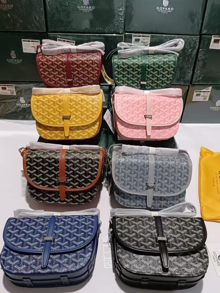 Goyard Chevron Shoulder Bag - Multiple Colors Available (Category: Luxury Bags & Wallets) located in Manila. Submitted by dextee2805197 (Listing ID 1462505826, Image 1). Description: Goyard shoulder bags in various colors. Classic chevron pattern. Adjustable strap and buckle closure. Perfect for everyday use. Each bag comes with its own dust bag. Available in burgundy, green, yellow, pink, black, grey, and blue. Get yours now!.