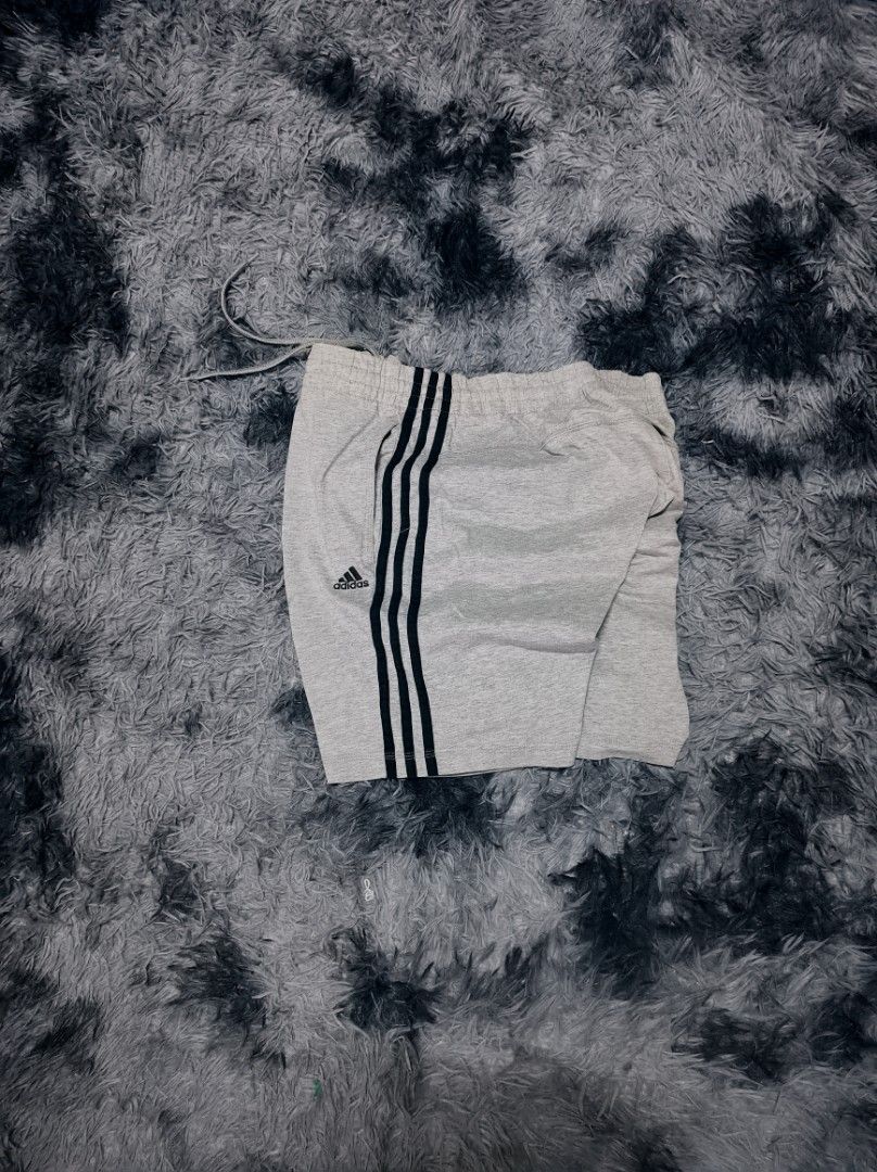 GRAY ADIDAS SHORTS (Category: Shorts) located in Taguig. Submitted by steeze_plug (Listing ID 1462488361, Image 2). Description: EXCELLENT Condition! No any issues Complete tags (authentic piece) ✅ 10/10 color rate (No fades / discolorations) ✨ Embroidered logo Solid neto! 🙌 Dimes: Free waistline size 18 length 🚛 J&T/FLASH EXPRESS delivery ➤ (Payment must be processed first) 🛵 Can also do Lalamove delivery if malapit ➤ (Can do COD, online paym