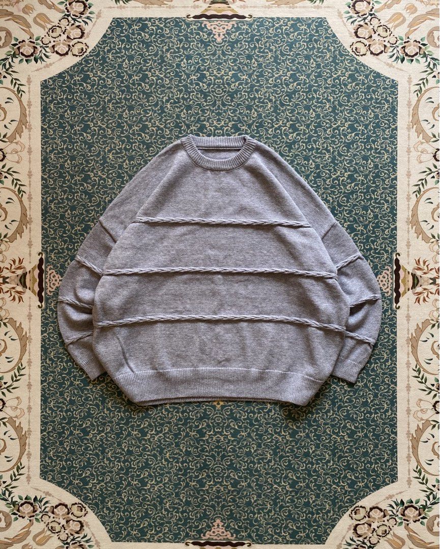 Grey Knit Sweater with Textured Stripes (Category: Coats, Jackets and Outerwear) located in Rizal. Submitted by Thethriftgood (Listing ID 1462639650, Image 1). Description: knitted cable stripped sweater dark gray Model height - 5’9 size: medium fit large (boxy cropped) dimensions: width - 26.5 length - 27 10/10 condition | issue: none Php: 1,200.