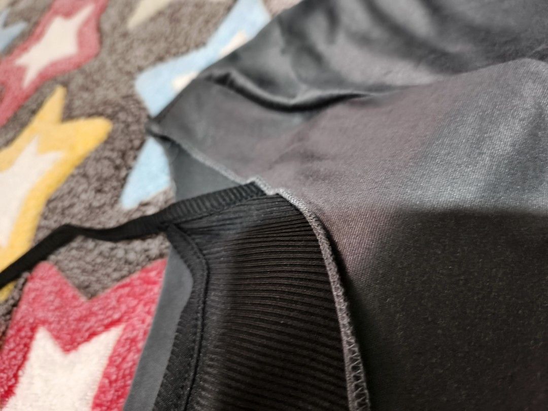 Grey Long Sleeve Top with Black Inner Layer (Category: Blouses) located in Cebu City. Submitted by straw.berry.milk.24 (Listing ID 1462647792, Image 2). Description: - Grey long sleeve top - Black inner layer with ribbed neckline - Outer layer has a satin-like sheen - Versatile: great for layering or wearing on its own - Reason for selling: no longer fits.