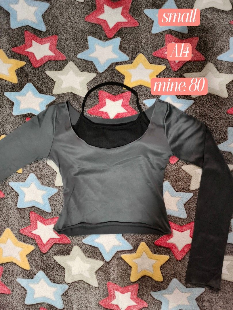 Grey Long Sleeve Top with Black Inner Layer (Category: Blouses) located in Cebu City. Submitted by straw.berry.milk.24 (Listing ID 1462647792, Image 1). Description: - Grey long sleeve top - Black inner layer with ribbed neckline - Outer layer has a satin-like sheen - Versatile: great for layering or wearing on its own - Reason for selling: no longer fits.