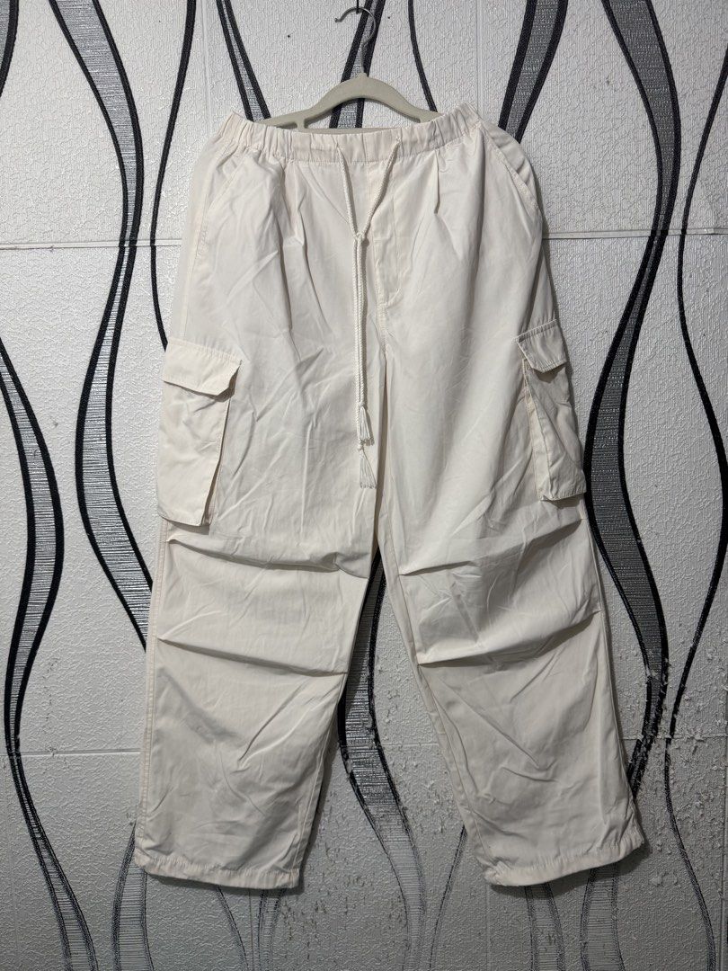 Gu parachute cargo pants (Category: Other Bottoms) located in Marilao. Submitted by yuzokii (Listing ID 1462605693, Image 3). Description: Gu parachute cargo pants (cream) Medium on tag 26-30 x 39 hem 9.5 Excellent condition No issue Marilao bulacan loc Jnt courier Payment first .