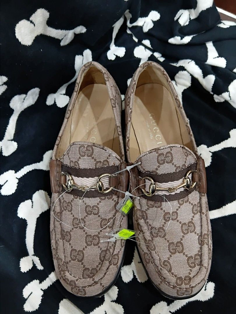 Gucci GG Canvas Loafers Size 36 (Category: Sneakers & Footwear) located in Subic. Submitted by adamdwyane (Listing ID 1462476722, Image 2). Description: - Authentic Gucci Loafers - Classic GG Canvas (Brown/Beige Monogram) - Signature Horsebit Detail - Made in Italy - Size: 36 - Condition: Soles show wear, interior is clean - A stylish pair of designer footwear.