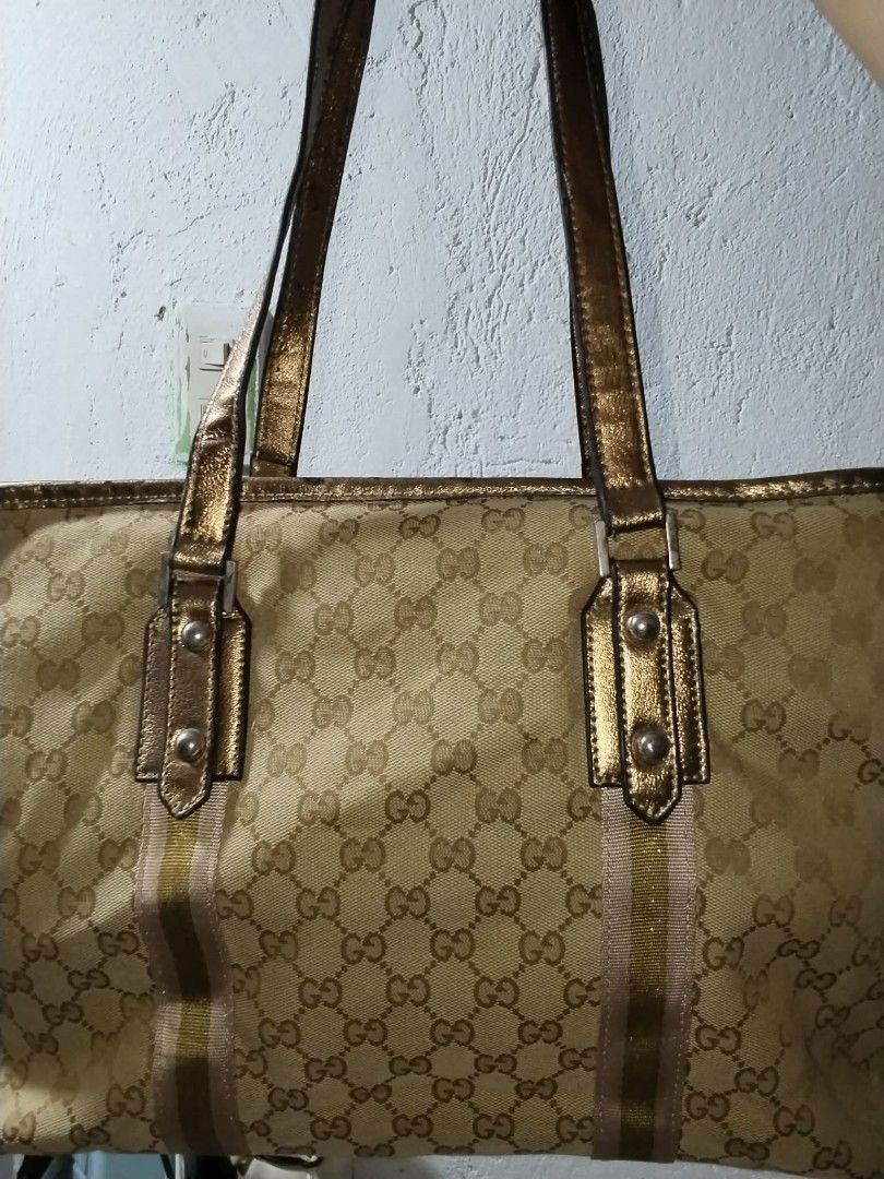 Gucci GG Monogram Tote Bag (Category: Shoulder Bags) located in Manila. Submitted by bagelyascollection (Listing ID 1462613042, Image 1). Description: - Authentic Gucci tote bag - Classic GG monogram canvas - Gold-tone hardware - Iconic Gucci logo and cute ball charm - Interior zipper pocket - Made in Italy - Serial number visible in photos.